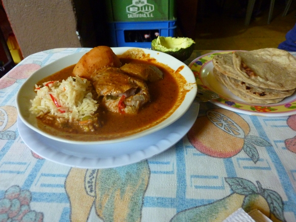 Pepian, a local chicken dish, always accompanied with avocado and tortillas
