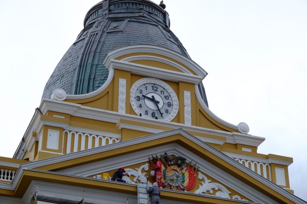 The arms of the clock in Plaza Murillo run unclock-wise. The Government want Bolivians to treasure their cultural differences and challenge themselves to think differently